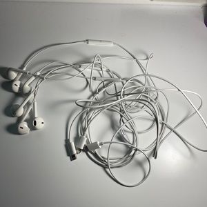 Three Apple headphones